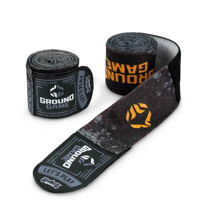 Odwinięte owijki bokserskie Ground Game Cage Gold przedstawiające wzór graficzny