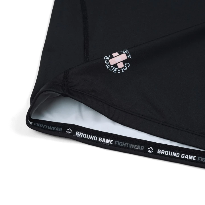 Silikonowy pas WrapStrap i wykończenie w rashguardzie Ground Game Injury Collector